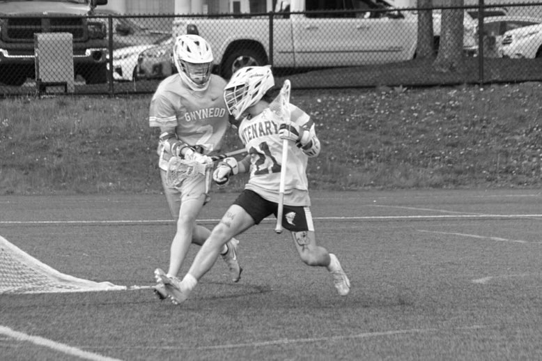 Matt Blanchard driving to the goal, black and white