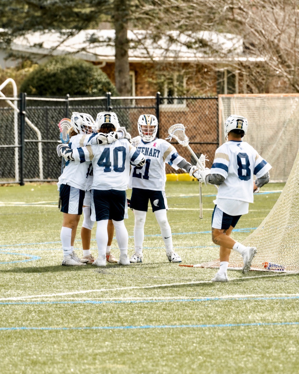 Team huddle celebration, #21 #40 #8